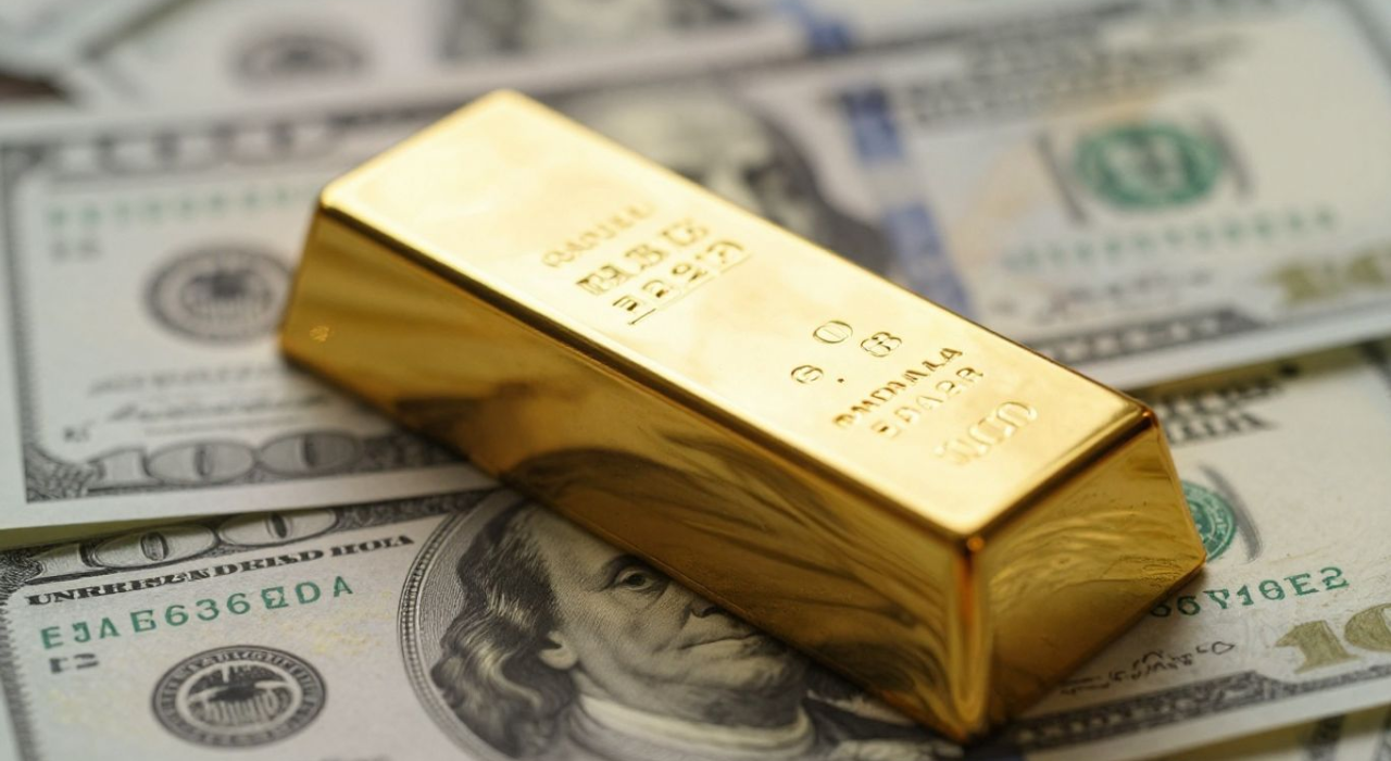 Ouro recua diante do dólar e do Fed